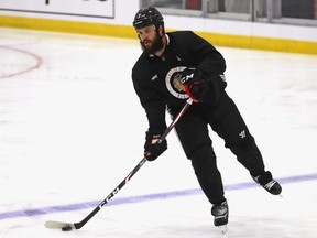 Blackhawks defenceman Brent Seabrook passes the puck during a summer training camp practice at Fifth Third Arena in Chicago, July 14, 2020.