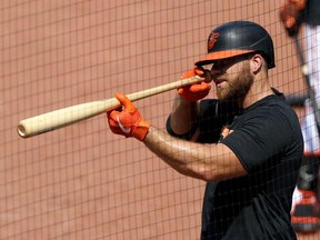 Chris Davis of the Baltimore Orioles looks at his bat while waiting to take batting practice during the Orioles first summer workout at Oriole Park at Camden Yards on July 3, 2020 in Baltimore.