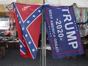 A vendor displays a confederate and Trump 2020 "Keep America Great!" flag outside the Bristol Motor Speedway prior to the NASCAR Cup Series All-Star Race at Bristol Motor Speedway, in Bristol, Tenn., July 15, 2020.