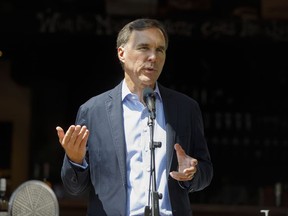 Finance Minister Bill Morneau speaks to media during a press conference in Toronto, Friday, July 17, 2020. The opposition parties are asking the federal ethics watchdog to widen his probe of Morneau regarding the WE organization as the finance minister continues to face calls for his resignation.