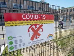 Almost two-third of parents in a new poll say they believe that children returning to school in the fall should wear a mask all, or part of the time. An elementary school in Montreal North is seen, Thursday, May 14, 2020 in Montreal.