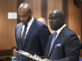 In this Aug. 9, 2018 file photo, Jamill Jones, left, appears in Queens Criminal Court in New York.  (Barry Williams/Dailymail.com via AP, Pool, File)