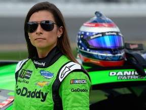 Danica Patrick stands by her car during qualifying for the Monster Energy NASCAR Cup Series Daytona 500 at Daytona International Speedway on February 11, 2018 in Daytona Beach.