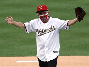 Dr. Anthony Fauci, director of the National Institute of Allergy and Infectious Diseases, reacts after throwing out the ceremonial first pitch prior to the game between the New York Yankees and the Washington Nationals at Nationals Park on July 23, 2020 in Washington.