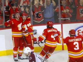 The Calgary Flames’ Andrew Mangiapane (88) celebrates with teammates after scores the opening goal against the Colorado Avalanche in Game 1 of their first-round NHL playoff series at Scotiabank Saddledome in Calgary on Thursday, April 11, 2019. Darren Makowichuk/Postmedia