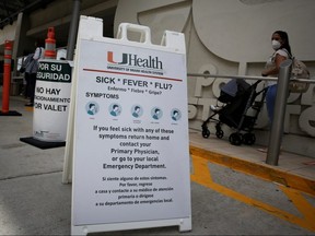 A sign is seen at the entrance of Jackson Memorial Hospital in Miami June 18, 2020.
