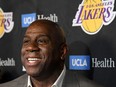 FILE: Magic Johnson reacts as he speaks to the press resigning as Los Angeles Lakers President of Basketball Operations before the game against the Portland Trail Blazers at Staples Center on Apr. 09, 2019 in Los Angeles, Calif.