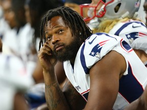 Michael Bennett of the New England Patriots looks on from the sidelines during the preseason game against the Detroit Lions at Ford Field on August 8, 2019 in Detroit, Michigan.