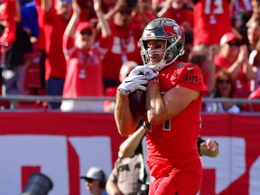 Cameron Brate of the Tampa Bay Buccaneers scores on a 3-yard reception thrown by Jameis Winston during the second quarter of a football game against the Indianapolis Colts at Raymond James Stadium on Dec. 8, 2019 in Tampa, Fla.