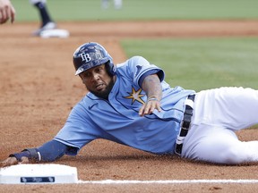 Jose Martinez of the Tampa Bay Rays slides safely at third base in the second inning of a Grapefruit League spring training game against the New York Yankees at Charlotte Sports Park on Feb. 23, 2020 in Port Charlotte, Florida.