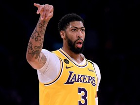 Anthony Davis of the Los Angeles Lakers looks at the Brooklyn Nets bench after his three pointer during a 104-102 Nets win at Staples Center on March 10, 2020 in Los Angeles, California.