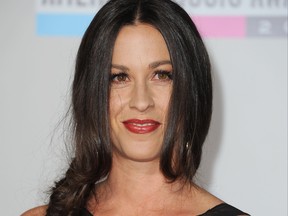 Alanis Morissette arrives at the American Music Awards in Los Angeles on Nov. 20, 2011.