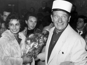 American actor John Wayne, right, and Italian actress Sophia Loren.