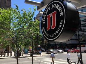 A logo of the sandwich restaurant chain, specializing in delivery Jimmy John's hangs outside one of their shops in downtown Washington, DC, June 9, 2016.