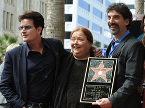 "Two and a Half Men" actress Conchata Ferrell, centre, is pictured with co-star Charlie Sheen, left, and show producer and writer Chuck Lorre during Lorre's Hollywood Walk of Fame star unveilling in Los Angeles, March 12, 2009.