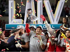 Kansas City Chiefs' Patrick Mahomes celebrates with the Vince Lombardi trophy after winning the Super Bowl LIV