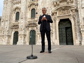 Italian opera singer Andrea Bocelli rehearses in an empty Duomo square on Easter Sunday ahead of a livestreamed concert for the event ''Music for hope'', inside the empty Duomo cathedral, which is intended as a symbol of love, hope and healing amidst the coronavirus disease (COVID-19) outbreak, in Milan, Italy, April 12, 2020.
