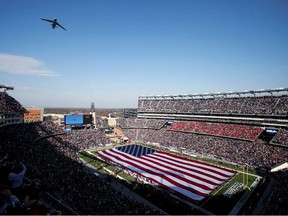 FILE PHOTO: An Airforce C5 does a flyover above Gillette stadium before the New England Patriots play against the Buffalo Bills in a NFL football game in Foxborough, Massachusetts, November 11, 2012. REUTERS/Dominick Reuter/File Photo ORG XMIT: FW1