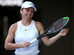 FILE PHOTO: Tennis - Australian Open - Semi Final - Melbourne Park, Melbourne, Australia - January 30, 2020 Romania's Simona Halep reacts during her match against Spain's Garbine Muguruza REUTERS/Hannah Mckay/File Photo ORG XMIT: FW1