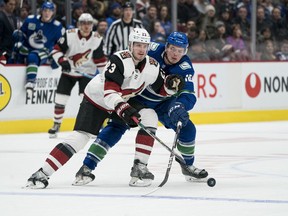 Vancouver Canucks' forward Jake Virtanen, right, believes his teammates will len on each other while trying to stickhandle around the COVID-19 restrictions in the NHL hub city of Edmonton.
