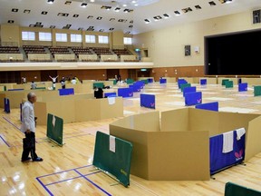 Local residents take shelter at an evacuation centre with space to maintain social distance in Yatsushiro city general gymnasium on July 6, 2020.