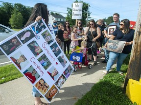 Family and friends of victims attend a march demanding an inquiry into the April mass shooting in Nova Scotia that killed 22 people, in Bible Hill, N.S. on Wednesday, July 22, 2020.