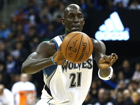 Minnesota Timberwolves star Kevin Garnett passes the ball against the Chicago Bulls during NBA exhibition action at MTS Centre in Winnipeg on Oct. 10, 2015.