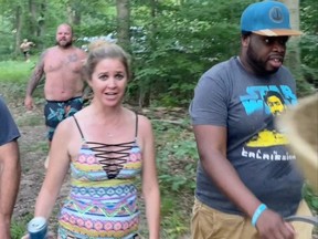 Vauhxx Booker (right) walks before what he said was an assault on him by several white men threatening to lynch him at Lake Monroe, Indiana on July 4, 2020, in this still image taken from video obtained from social media.