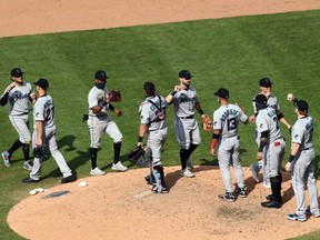 The Miami Marlins celebrate following their victory over the Philadelphia Phillies at Citizens Bank Park.
