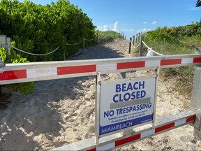 A sign informing about South Beach closure, to prevent the spread of the coronavirus disease (COVID-19), is seen ahead of the Fourth of July weekend, in Miami Beach, Florida July 3, 2020.