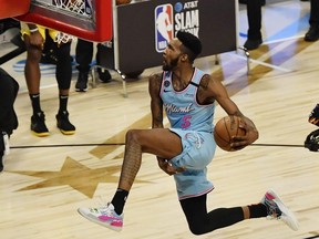 Miami Heat player Derrick Jones Jr. competes in the slam dunk contest during NBA All Star Saturday Night at United Center.