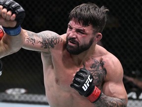 Mike Perry punches Mickey Gall (not shown) during UFC Fight Night at the UFC APEX in Las Vegas, June 27, 2020.