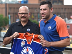 Oilers forward Milan Lucic and GM Peter Chiarelli before talking to the media in Edmonton, Friday, July 1, 2016.