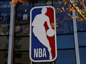 An NBA logo is seen on the facade of its flagship store at the Wangfujing shopping street in Beijing, Oct. 8, 2019.