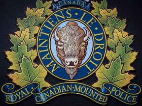 The RCMP logo is seen outside Royal Canadian Mounted Police "E" Division Headquarters, in Surrey, B.C., on Friday April 13, 2018. Members of the Transportation Safety Board are expected to arrive in Newfoundland today to investigate a fatal helicopter crash that occurred near Thorburn Lake yesterday.