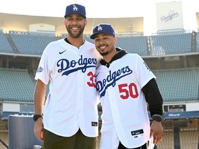 Newly acquired Los Angeles Dodgers Mookie Betts (right) and David Price are introduced at a press conference at Dodger Stadium on February 12, 2020 in Los Angeles.