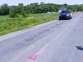 A police car drives along le Rang Sainte-Anne in Notre-Dame-de-Stanbridge, Que. on Thursday, July 2, 2020 where three children aged five and under died following a tractor accident on Canada Day. THE CANADIAN PRESS/Paul Chiasson ORG XMIT: pch103