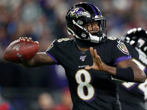 Quarterback Lamar Jackson of the Baltimore Ravens drops back to pass against the New York Jets at M & T Bank Stadium on December 12, 2019 in Baltimore.