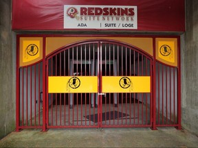 The NFL's Washington Redskin's logo is stamped in a steel gate at FedEx Field July 13, 2020 in Landover, Maryland.