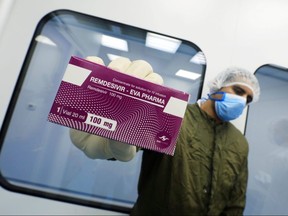 A lab technician shows the coronavirus treatment drug remdesivir at Eva Pharma Facility in Cairo, Egypt June 25, 2020.