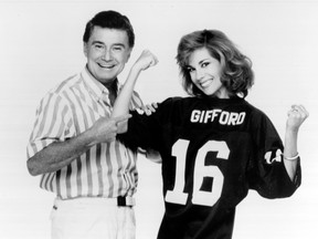 TV hosts Regis Philbin and Kathie Lee Gifford kid around for the camera during a studio session.