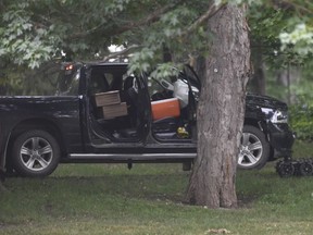 CP-Web.  A police robot is shown near a pickup truck inside the grounds of Rideau Hall in Ottawa on Thursday, July 2, 2020. The RCMP say they have safely resolved an "incident" at Rideau Hall, where Gov. Gen. Julie Payette and Prime Minister Justin Trudeau live.THE CANADIAN PRESS/Adrian Wyld ORG XMIT: AJW513