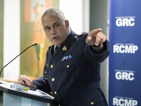 RCMP Deputy Commissioner Mike Duheme points towards a map with timestamps indicating the path of an armed man who breached the gates of Rideau Hall on Thursday, during a news conference at the RCMP National Division in Ottawa, on Friday, July 3, 2020.