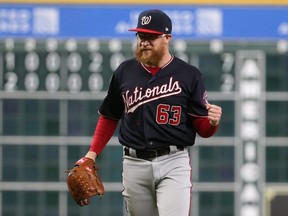 Washington Nationals pitcher Sean Doolittle celebrates after defeating the Houston Astros in Game 6 of the 2019 World Series at Minute Maid Park.