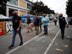 Members of the Seattle Police homicide unit leave the scene of a fatal shooting in the Capitol Hill Organized Protest area as people occupy space in the aftermath of the death in Minneapolis police custody of George Floyd, in Seattle, June 29, 2020.