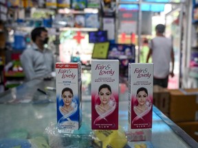 This photo taken on July 8, 2020 shows packages of Unilever "Fair and Lovely" skin-lightening creams on the counter of a shop in New Delhi.