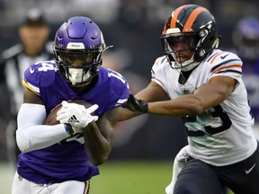 Minnesota Vikings wide receiver Stefon Diggs (14) runs with the football against Chicago Bears cornerback Kyle Fuller (23) at Soldier Field.