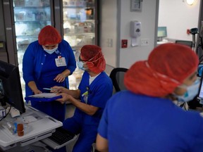 Healthcare workers in the ICU at Oakbend Medical Center in Richmond, Texas, on July 15, 2020.