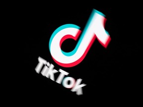 In this file photo taken on November 21, 2019 shows the logo of the social media video sharing app Tiktok displayed on a tablet screen in Paris.