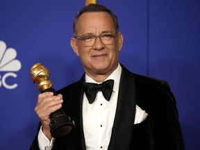 Tom Hanks poses backstage with his Cecil B. DeMille award during the Golden Globes Jan. 5, 2020 in Beverly Hills.